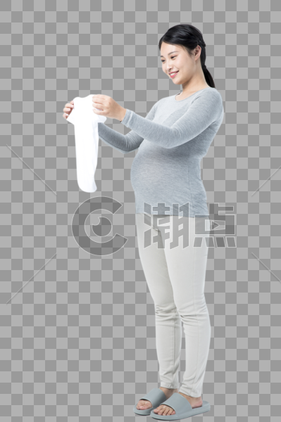 孕妇拿着婴儿衣物图片素材免费下载