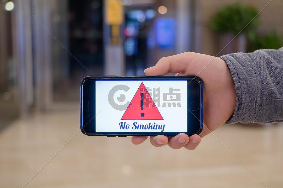 用手机宣传世界禁烟日图片素材免费下载