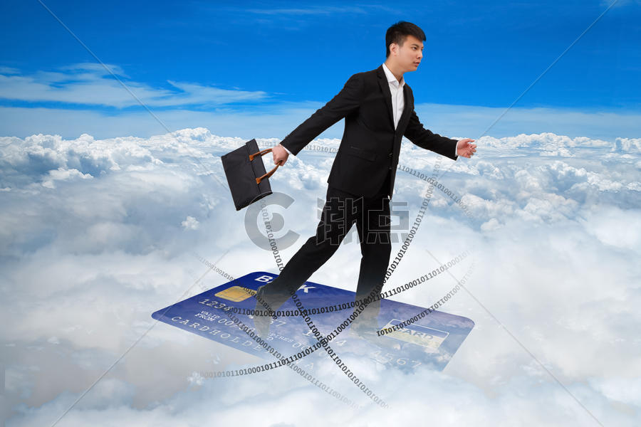 拿着包踩着卡飞行在云端的商务男士图片素材免费下载