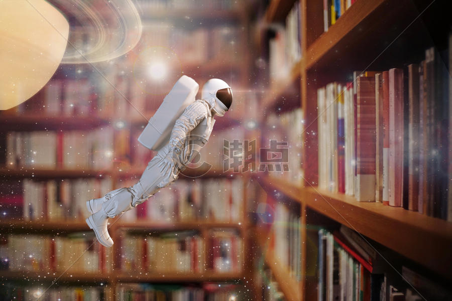 书中漫游的太空人图片素材免费下载