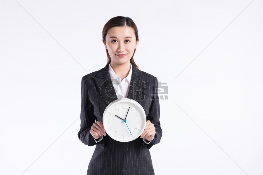 商务女性手拿时钟图片素材免费下载