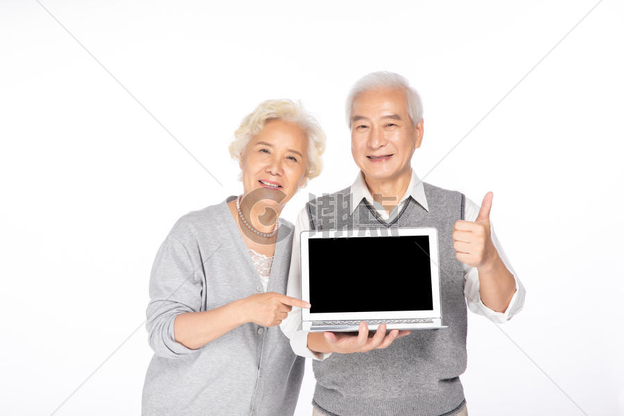 老年人手拿电脑图片素材免费下载