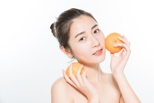 美妆女性与橙子图片素材免费下载