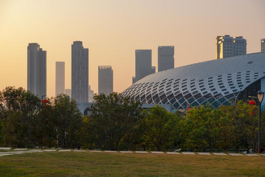 夕阳下的深圳体育中心公园图片素材免费下载