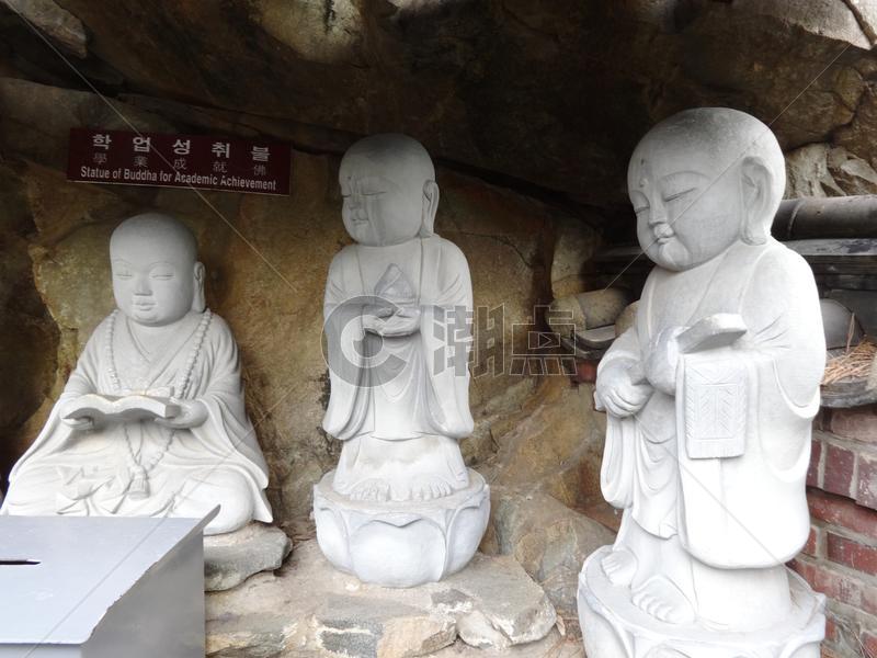 韩国釜山的小和尚石雕图片素材免费下载