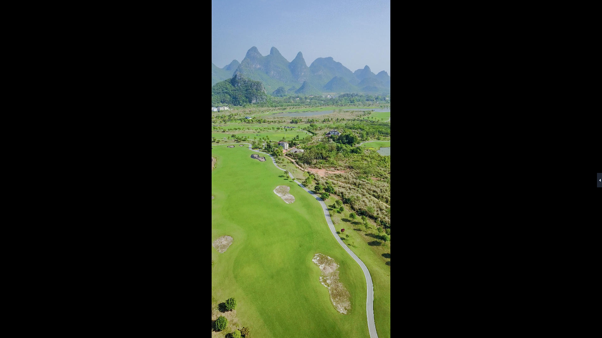 竖拍竖屏航拍高尔夫球场绿地春天风景休闲娱乐视频的预览图