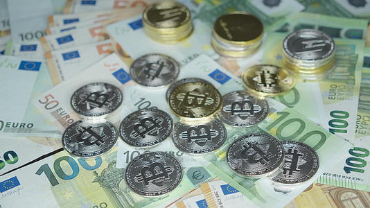 10欧元钞票和金比特币加密货币投资概念加密采矿或交易视频的预览图