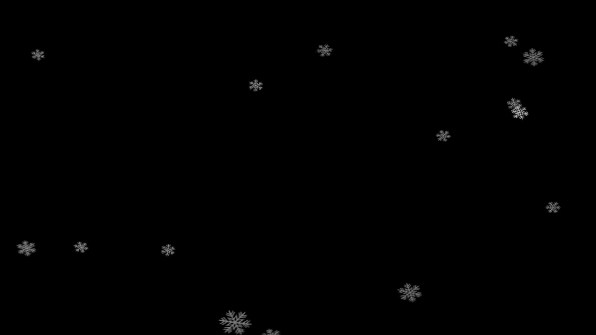 有纹理的雪花落在黑色背景上视频的预览图