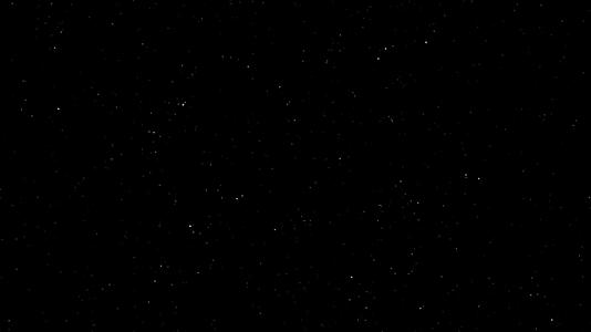 在黑色背景下白色粒子在空间中以黑色小恒星的形式缓慢移动视频的预览图