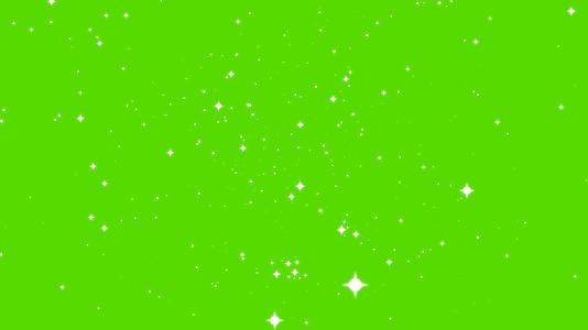 绿色屏幕背景淡化了绿色屏幕背景中缓慢闪烁的粒子视频的预览图