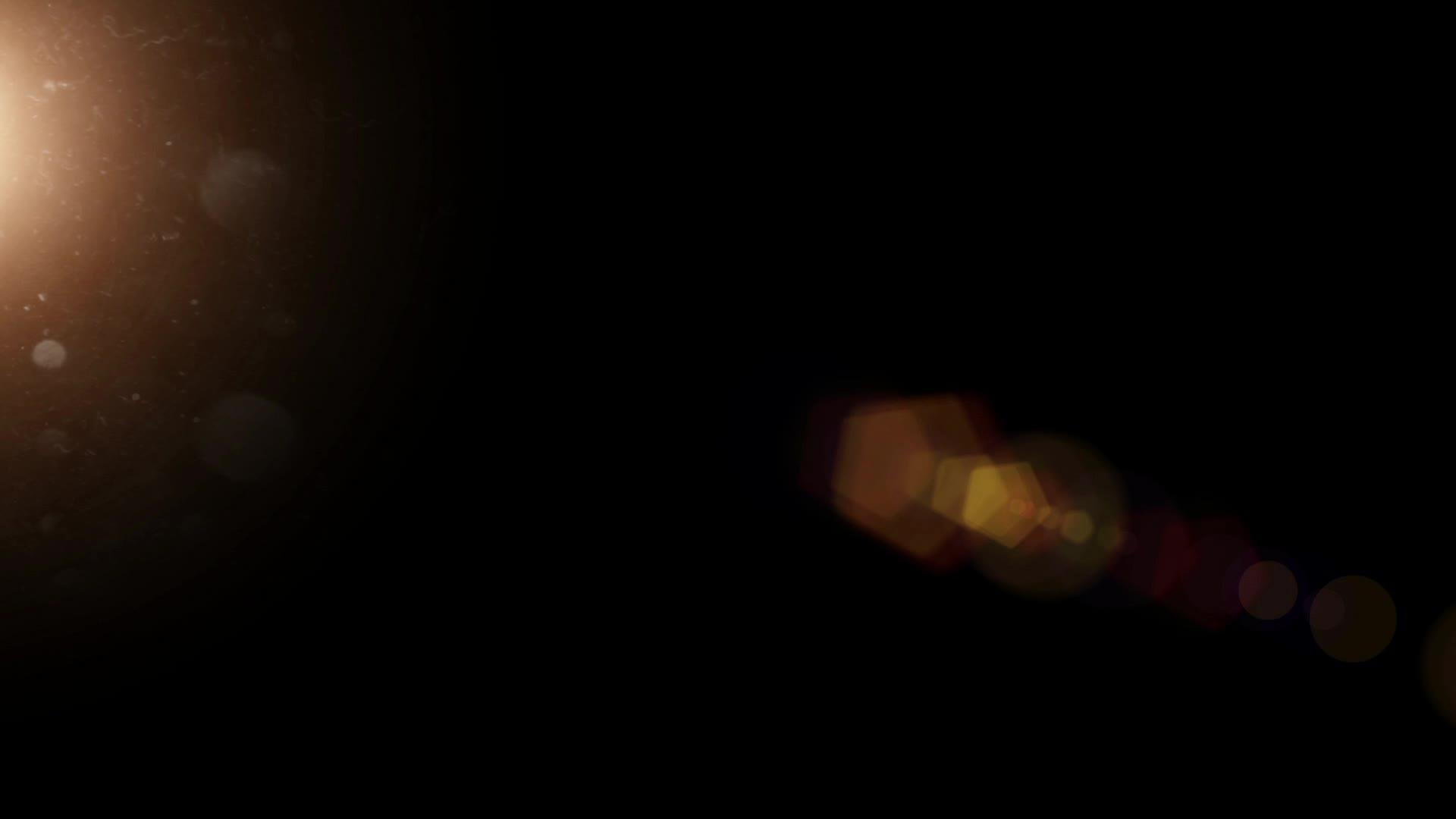黑色背景的金球太阳耀斑视频的预览图
