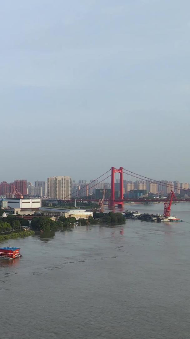 航拍长江中下游汛期防洪最大洪峰过境后水位超过道路防洪材料视频的预览图