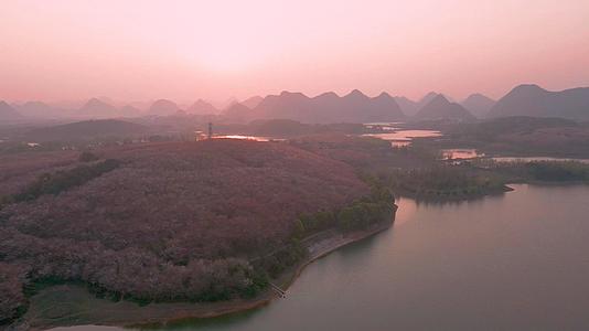 4K航拍日落时分贵州网红打卡地樱花谷视频素材视频的预览图