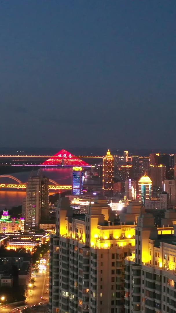 哈尔滨松花江畔高楼群夜景航拍视频视频的预览图