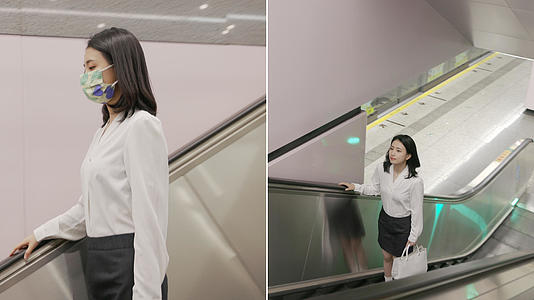 女生在地铁站乘坐扶梯视频的预览图