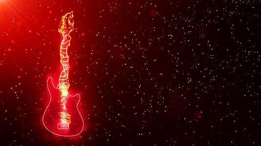 燃烧的电吉他被明亮的颗粒和热空间的光效应包围视频的预览图