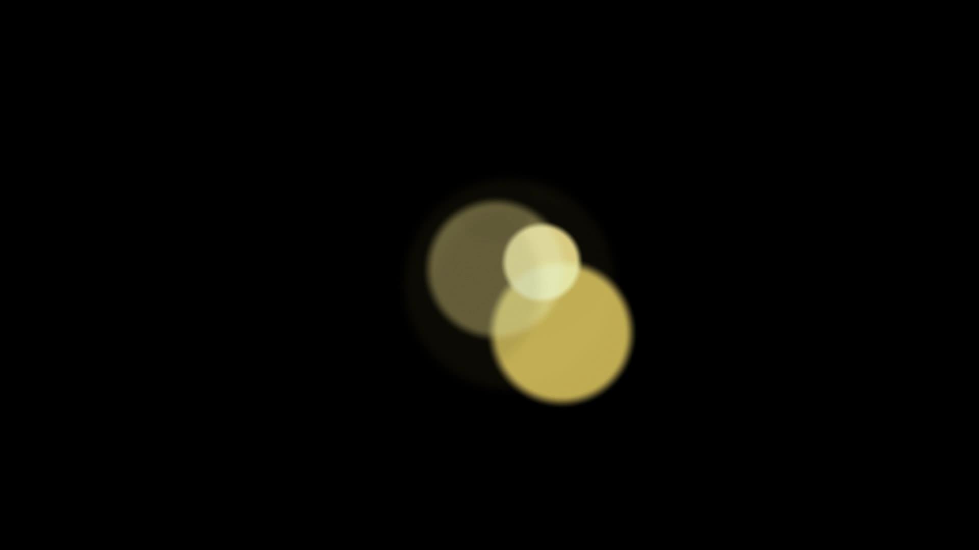 黑色背景上的圆形黄色灯光模糊不清视频的预览图