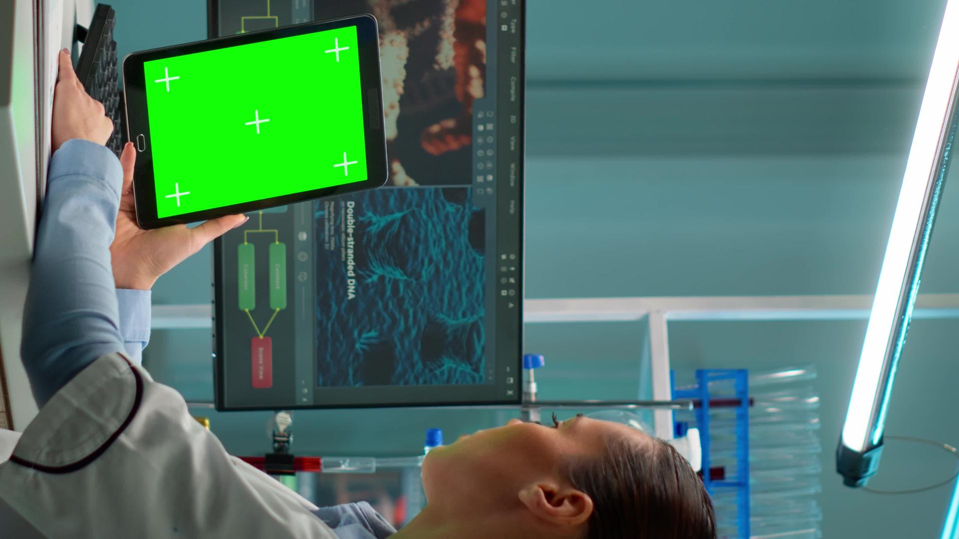 用绿色染色体键显示的垂直视频注纸工作微生物学家垂直版视频的预览图