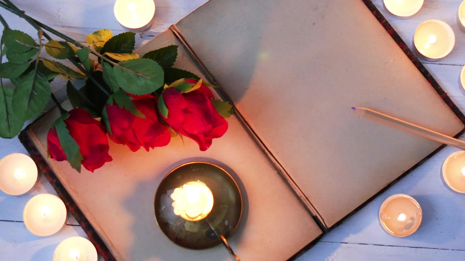 旧笔记本玫瑰和小蜡烛视频的预览图