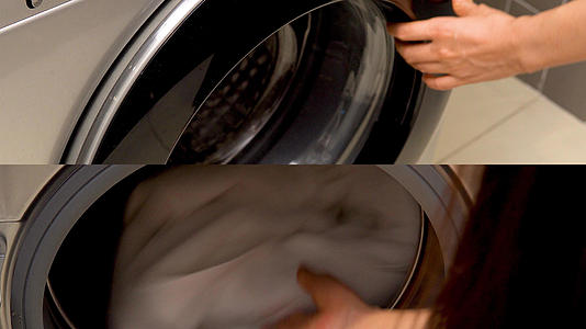 洗衣机放衣服动作特写视频的预览图