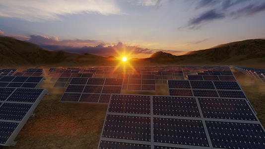 太阳能电池板散落在沙漠中相对于山和美丽的日落视频的预览图