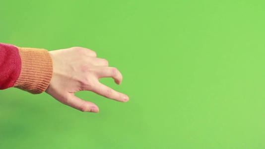 孤立的摄影棚绿色背景手势视频的预览图