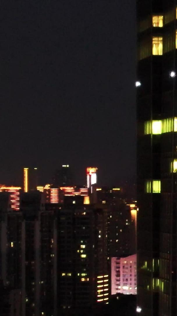 航拍城市夜景写字楼互联网公司灯火通明办公楼加班材料视频的预览图