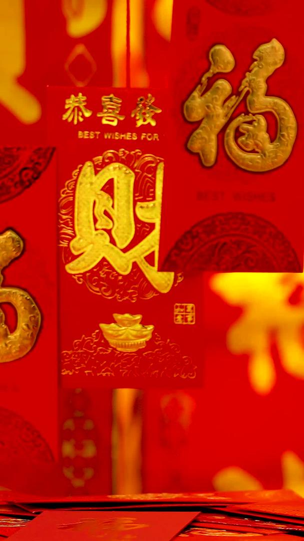 红色喜庆背景前悬挂红包福字礼盒实拍静物视频视频的预览图