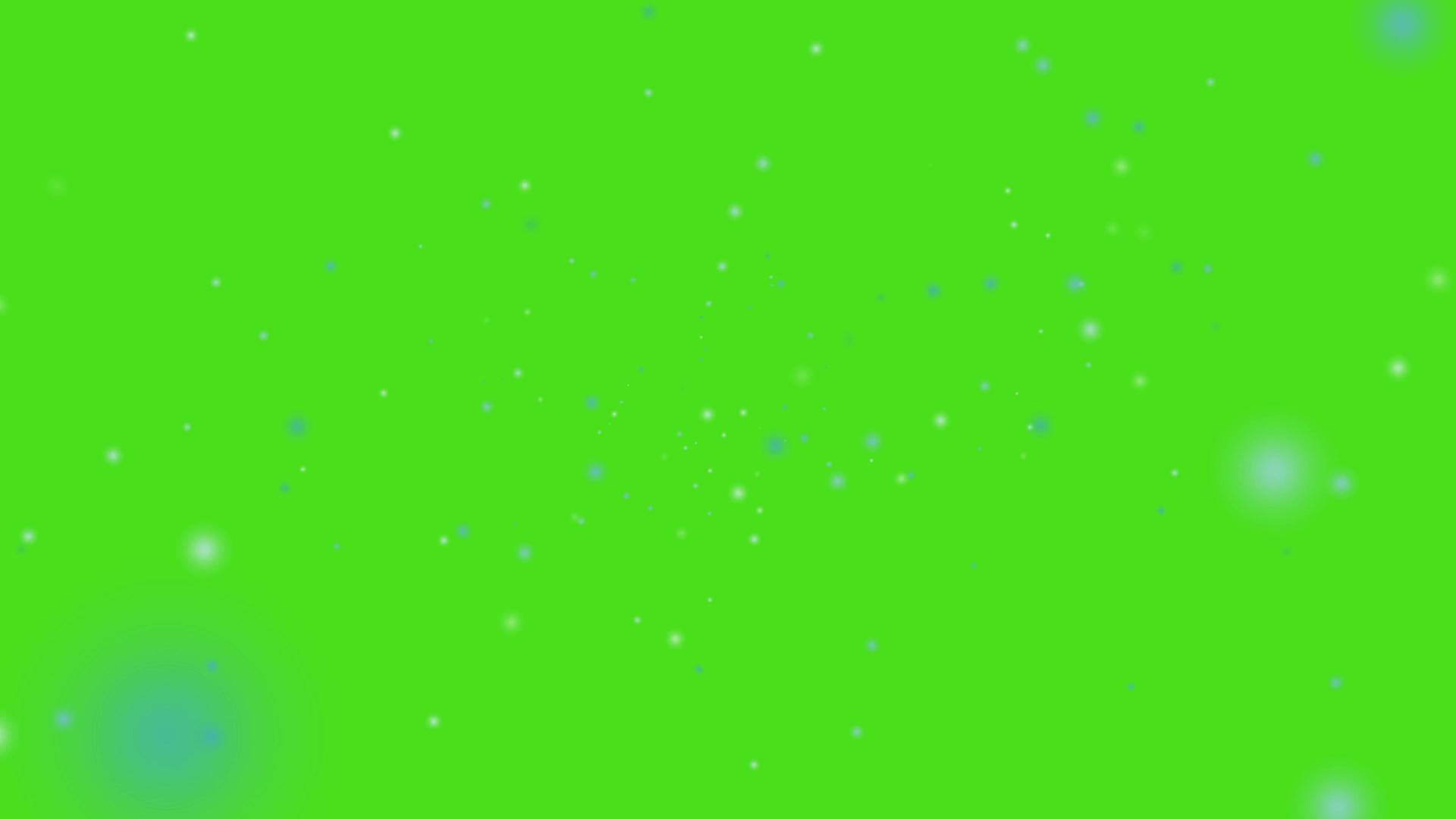 雪和冰尘慢慢地落在绿色的屏幕上视频的预览图