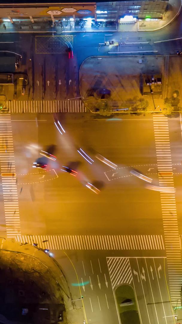 上海城市交通夜景十字路口俯视上空交通延迟摄影视频的预览图