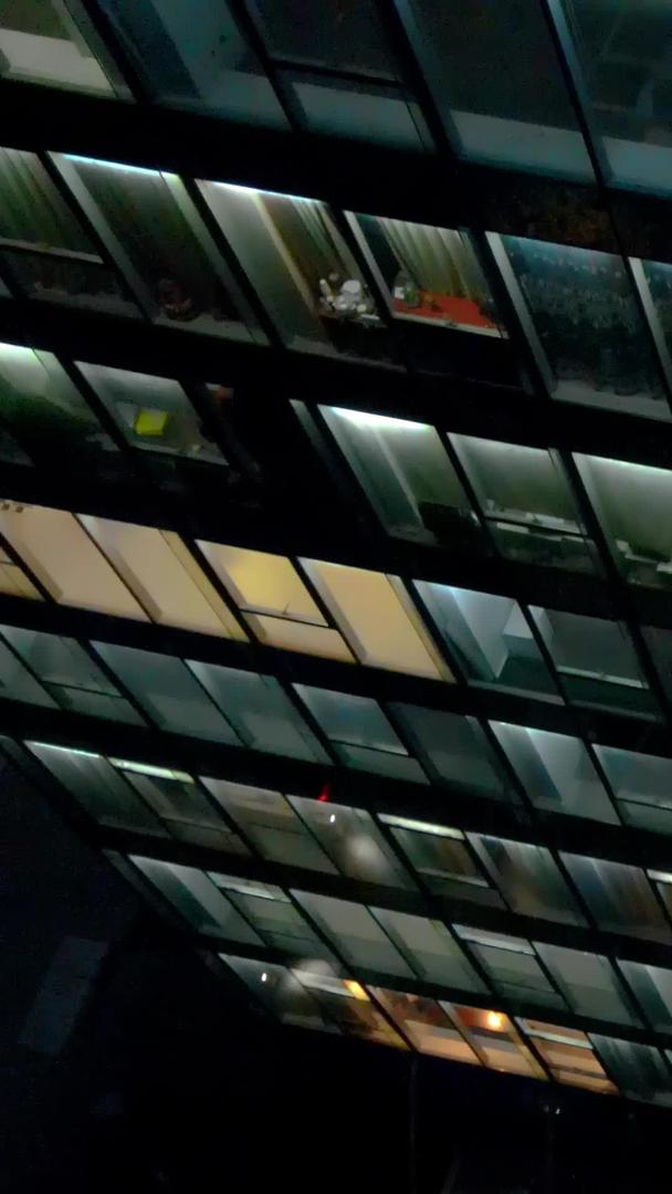 航拍城市夜景加班灯火通明大楼视频的预览图