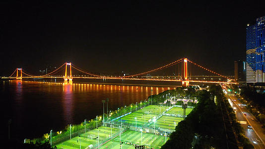 航拍城市江景夜景桥梁灯光足球场运动健身体育比赛场地4k素材视频的预览图