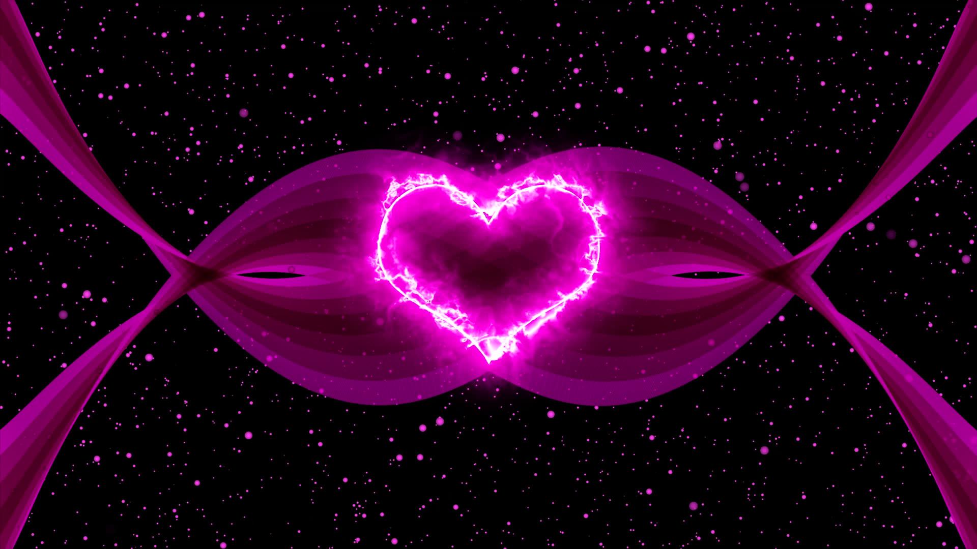 在黑色背景上移动粉色粒子中的发光情人的心视频的预览图