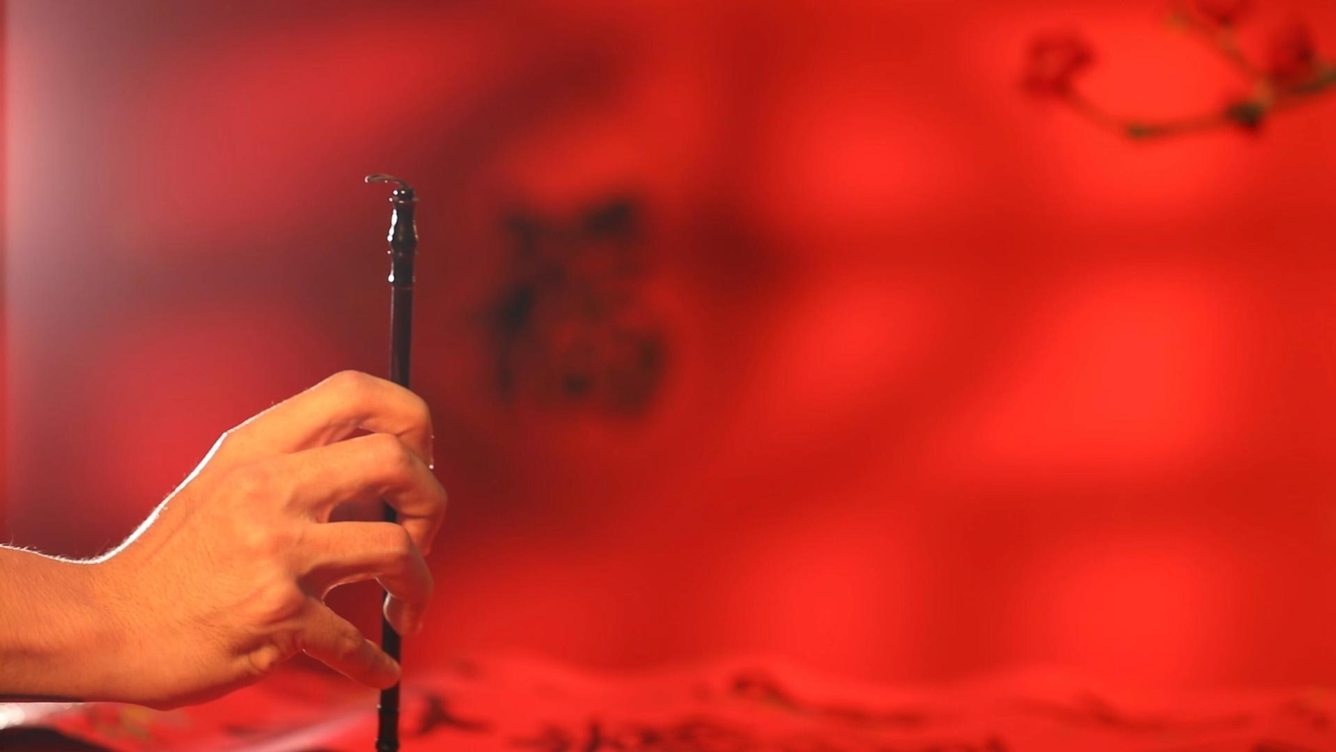 新春书法毛笔字红色背景实拍视频视频的预览图