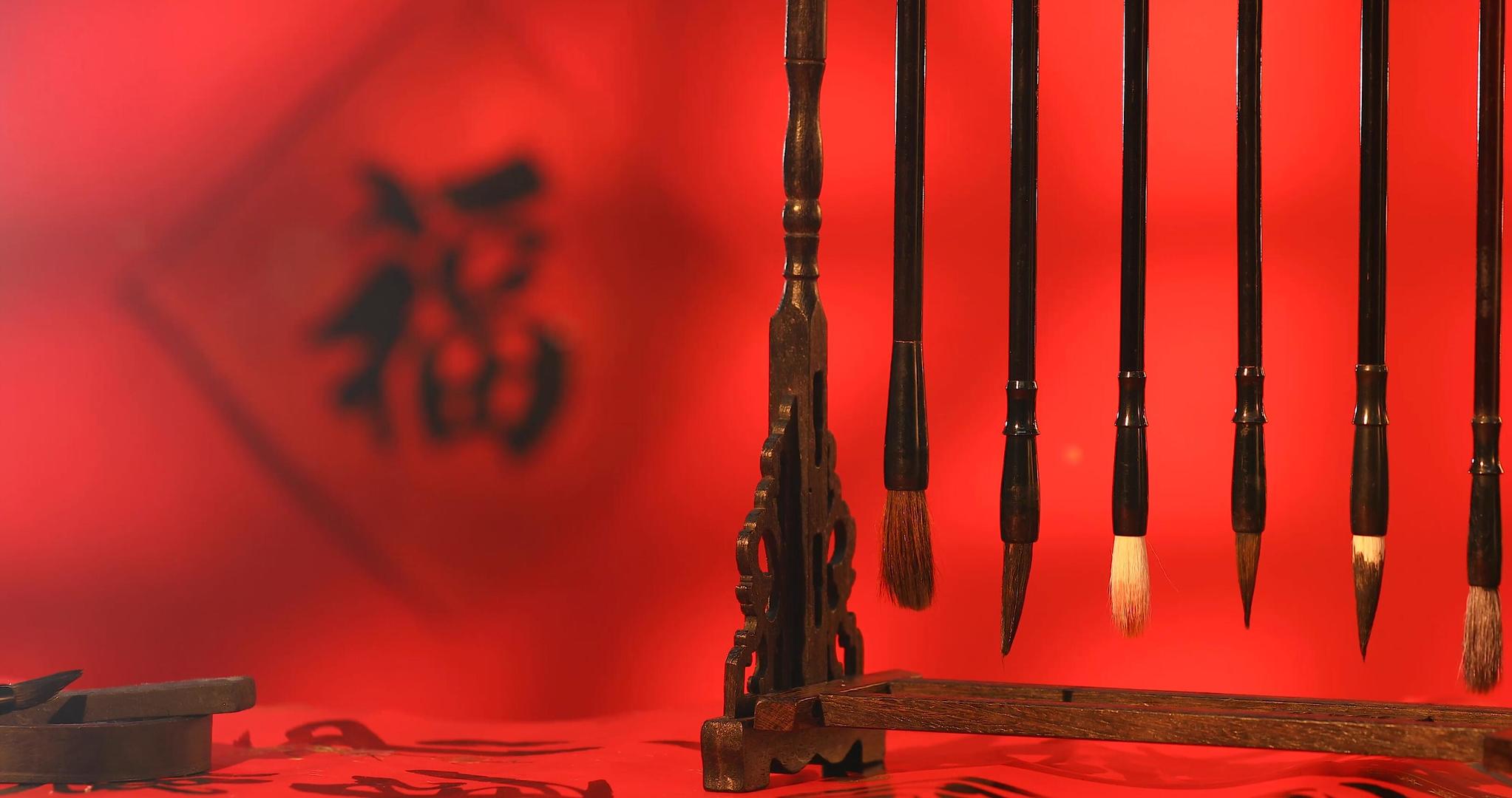 新春福字红色背景前文房四宝静物实拍视频的预览图