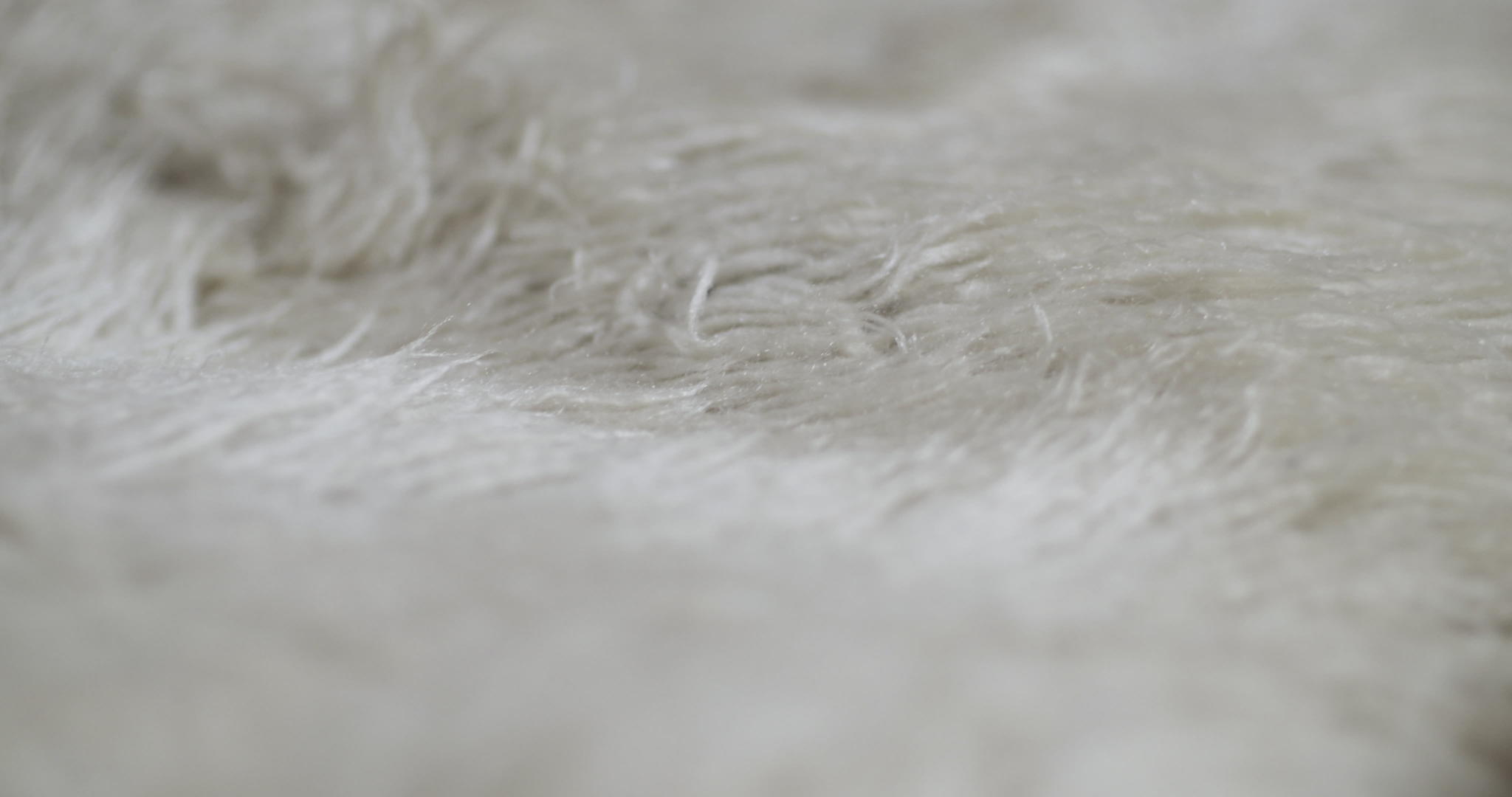 雅马布利亚白羊毛地毯的抽象纹理用作毯子或沙发视频的预览图