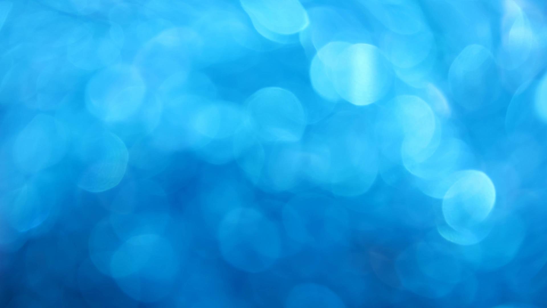 蓝色bokeh抽象的闪光背景视频的预览图
