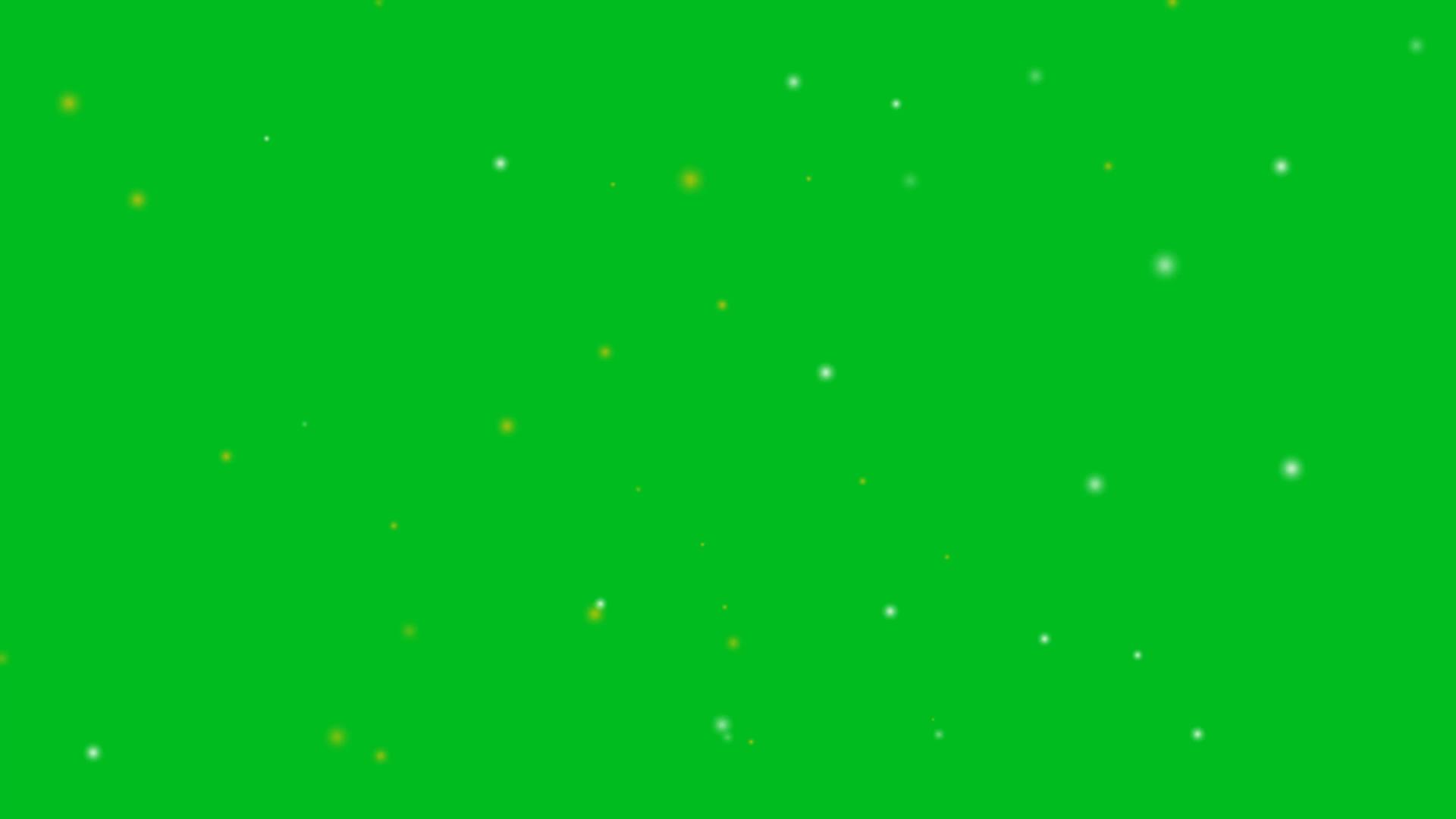 模糊的银色和金色的小雪在绿色屏幕的背景上飞走视频的预览图
