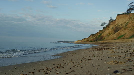 海洋日落海岸地平线上海海滩景观海浪拍打海岸岛视频的预览图