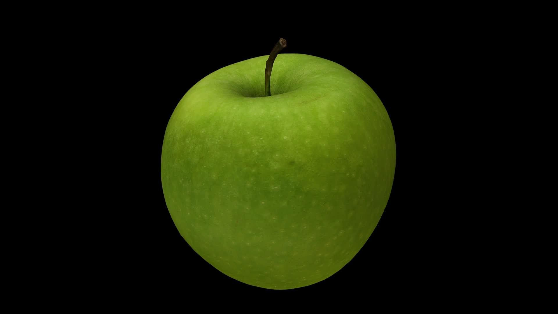 旋转绿苹果0的黑色背景a滚动视频的预览图