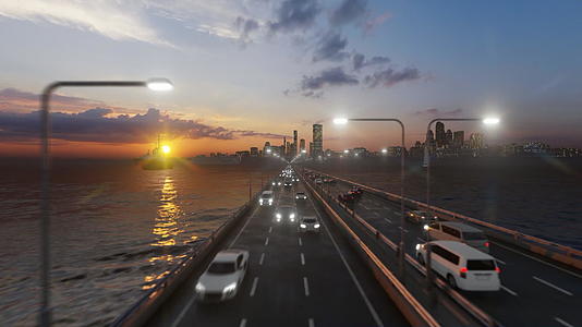 日落时夜城和水对面的高速公路在空中飞行视频的预览图