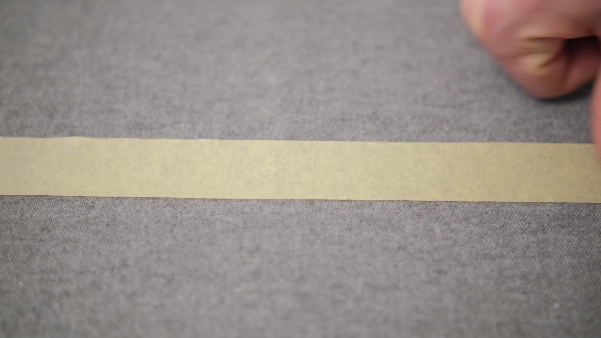 缝合灰色布料选择性背景将纸胶带粘在织物上视频的预览图