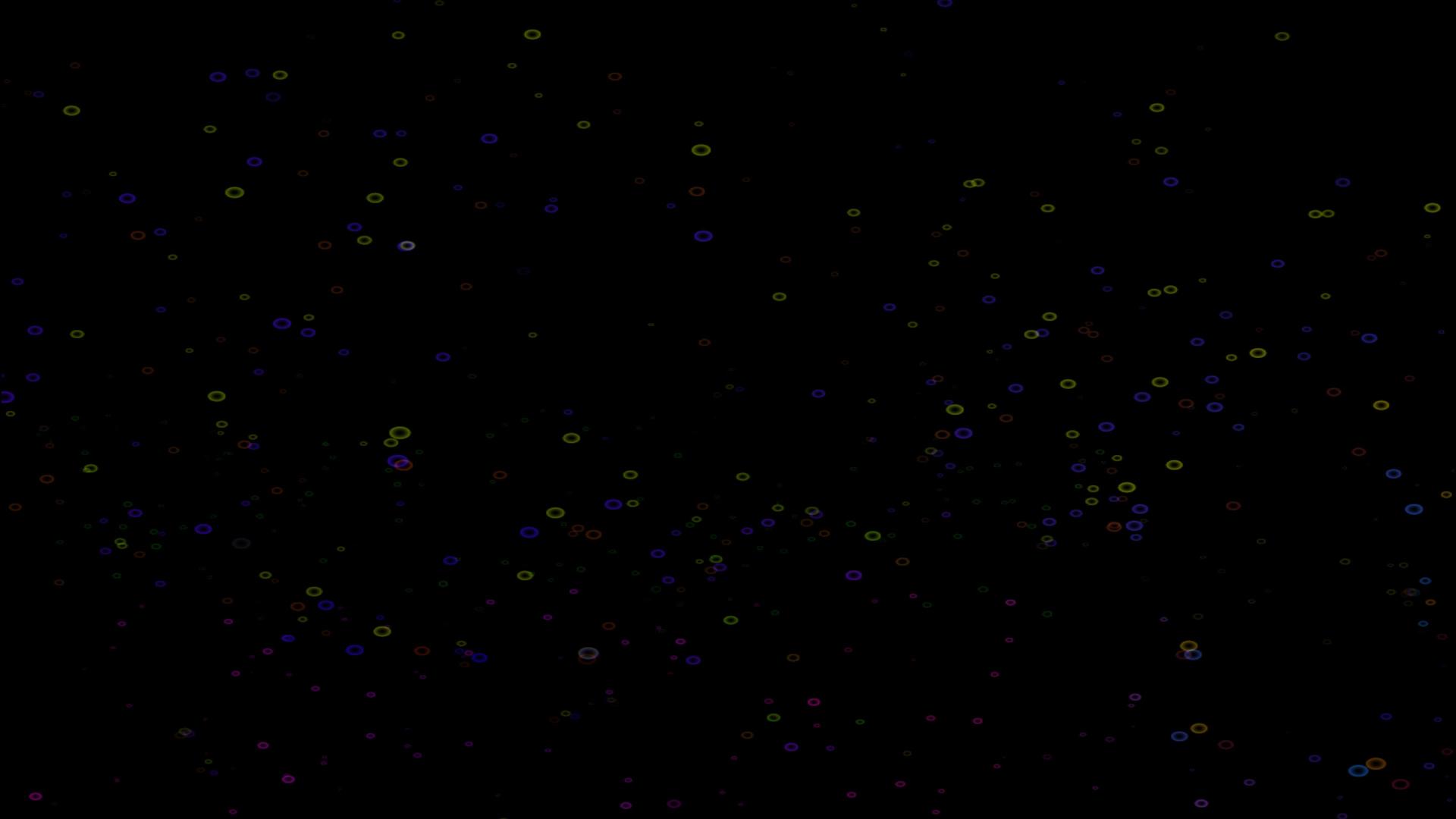 泡泡彩虹色彩漂浮在黑屏的顶部视频的预览图
