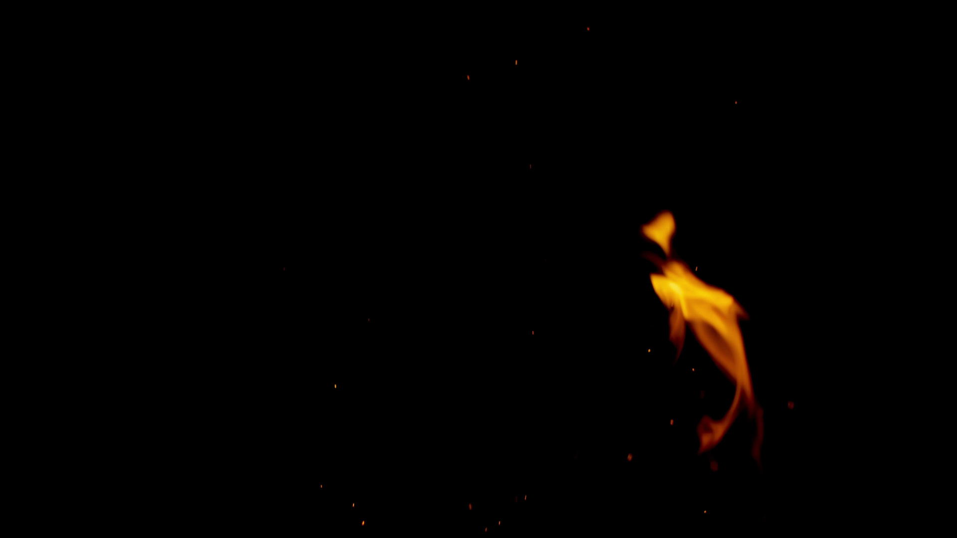 燃烧的橙色火焰和黑色背景的火花视频的预览图