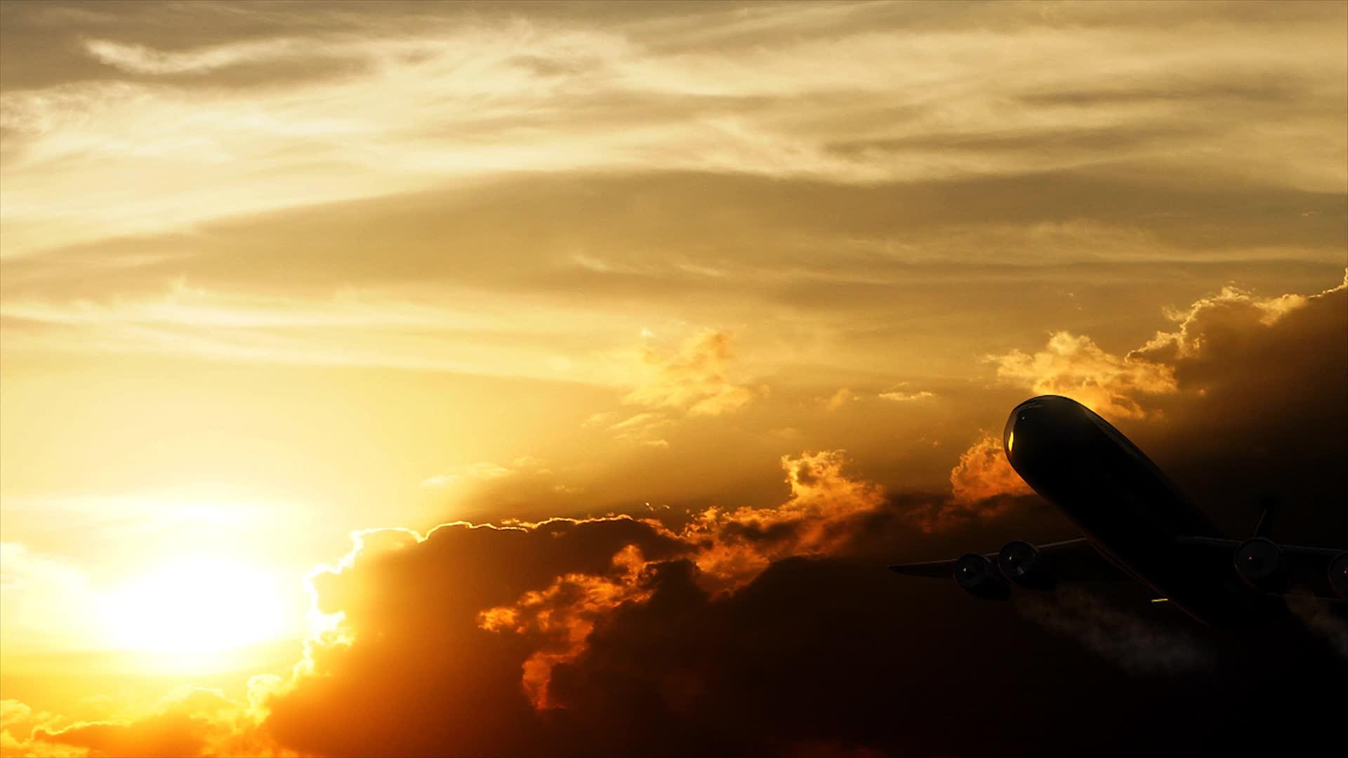 日落的橙色飞机飞过视频的预览图