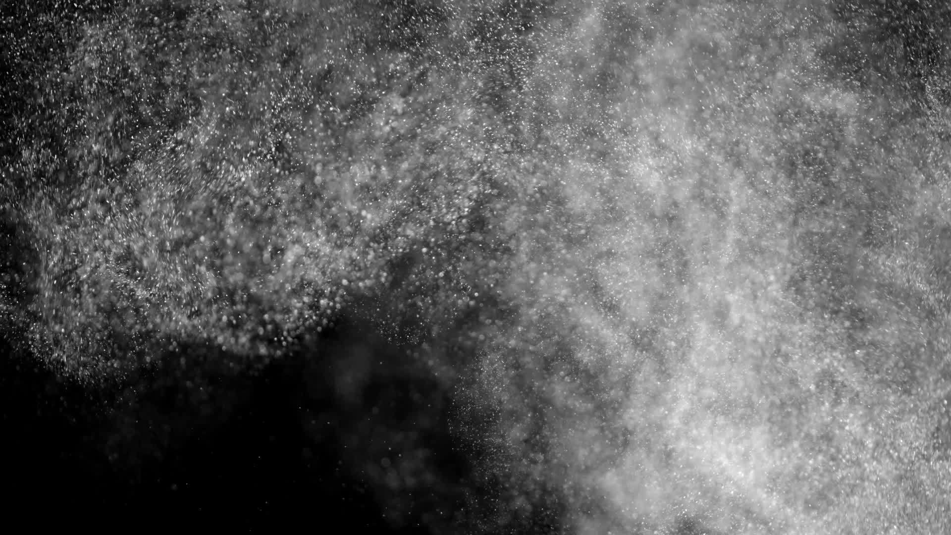 白色颗粒以黑色背景上的小空间和泡泡形式呈现视频的预览图