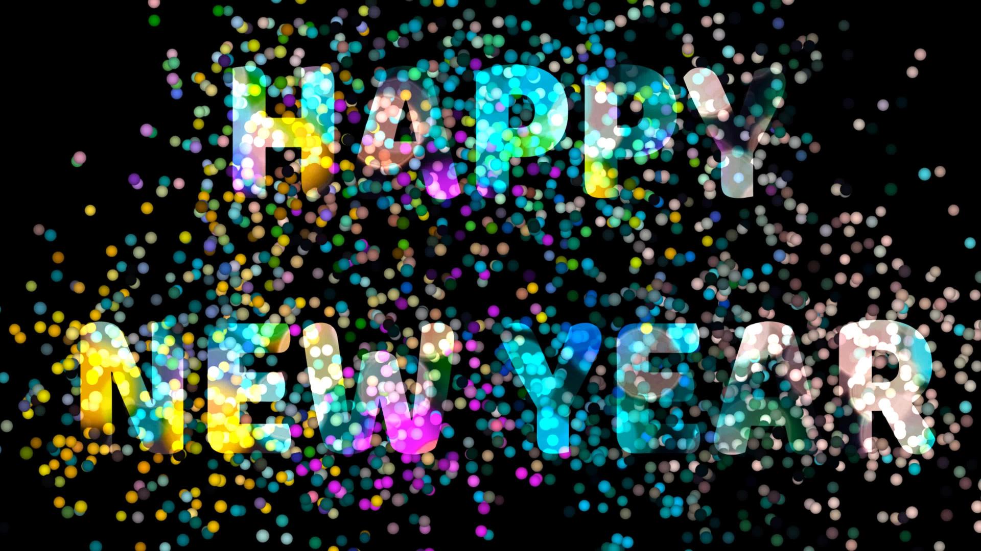 新年快乐文字标志和彩虹光球运动视频的预览图