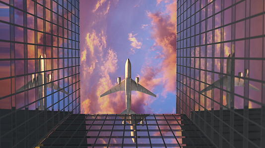 飞机飞越商业摩天大楼视频的预览图