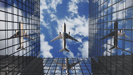 飞机飞越商业摩天大楼视频的预览图
