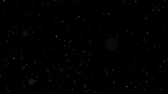 小白颗粒在黑色背景上飞行时的空间视频的预览图